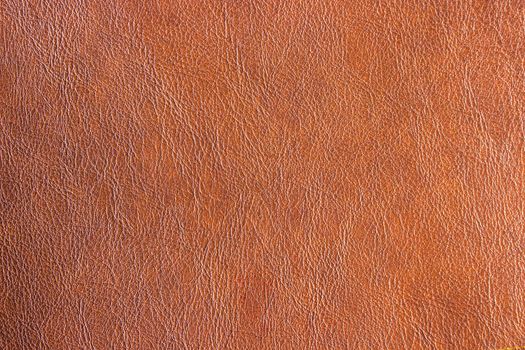 Closeup leatherette brown texture background. Abstract leather vintage