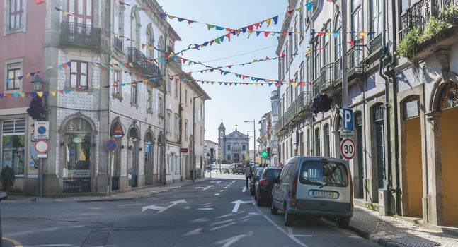 Ovar, Portugal - February 18, 2020: architectural detail of the typical houses of the city decorated for the carnival where people are walking on a winter day