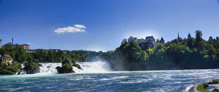 the famous rhine falls in the swiss near the city of Schaffhausen - sunny day and blue sky