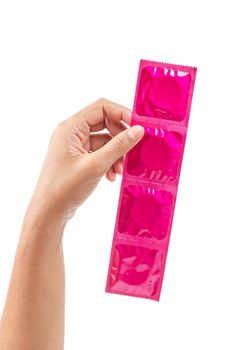 Hand showing pink condom isolated on white background, Save clipping path.