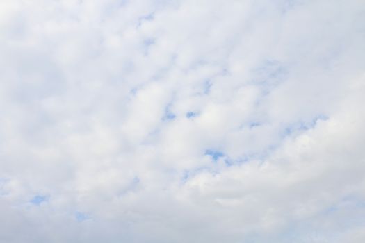 white sky fluffy clouds