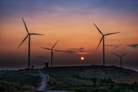 Wind Turbines over a sunset background.