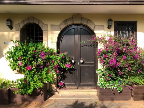 A facade of a historical old Ottoman time architecture building with gate and windows in Antalya Old town Kaleici. Horizontal stock image