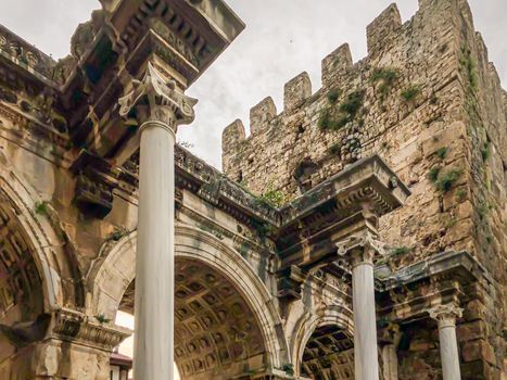 View of ancient monument Hadrian's Gate Uckapilar in old city of Antalya Kaleici, Turkey. Horizontal stock image.