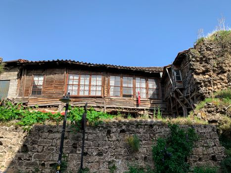 Old abandoned Ottoman time wooden house building in old town of Antalya Kaleici, Turkey. Horizontal stock image.