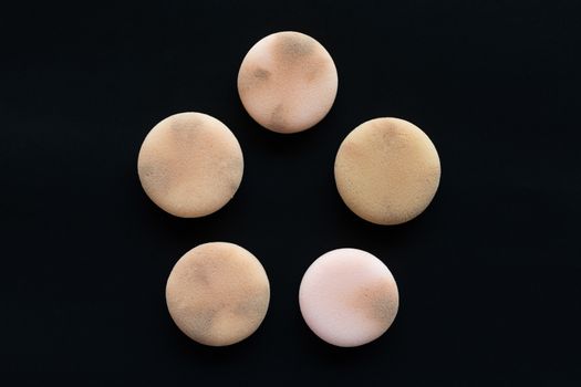 cosmetic sponges on used black background, Clipping path