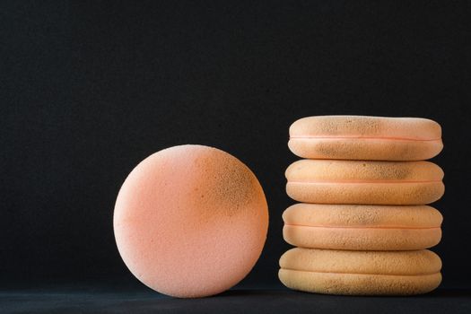 cosmetic sponges used on black background