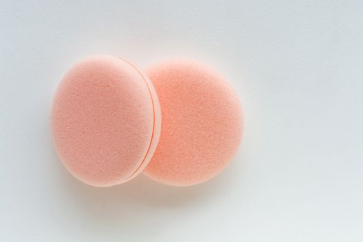 cosmetic sponges on white background