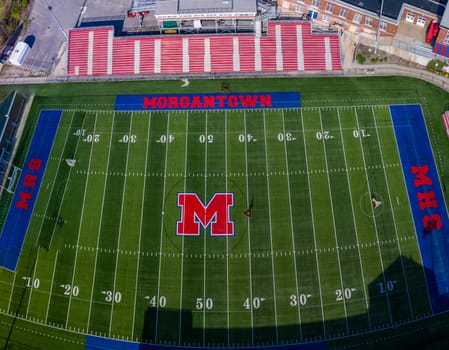 Morgantown, WV - 6 April 2020: Aerial drone view of the deserted Morgantown High school football field during lockdown