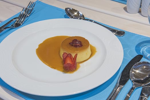 Creme caramel dessert food at luxury a la carte restaurant with sauce