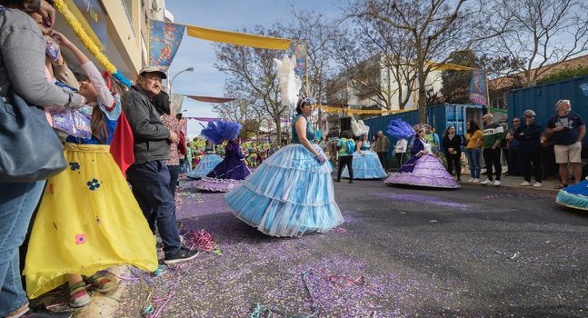 Loule, Portugal - February 25, 2020: dancers parading in the street in front of the public in the parade of the traditional carnival of Loule city on a February day