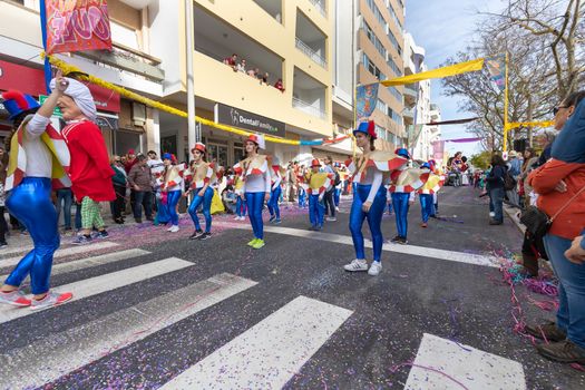 Loule, Portugal - February 25, 2020: dancers parading in the street in front of the public in the parade of the traditional carnival of Loule city on a February day