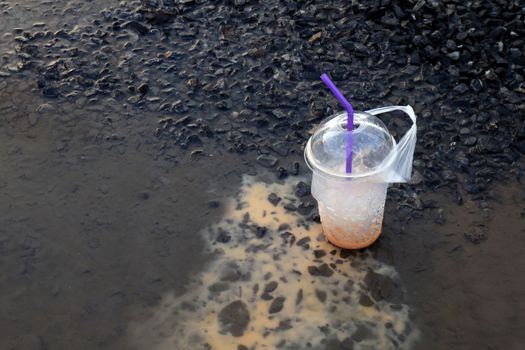 plastic waste, waste trash drink glass, water cup Juice dirty on floor