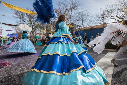 Loule, Portugal - February 25, 2020: dancers parading in the street in front of the public in the parade of the traditional carnival of Loule city on a February day