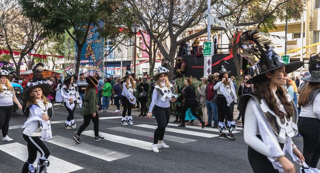 Loule, Portugal - February 25, 2020: dancers parading in the street in front of the public in the parade of the traditional carnival of Loule city on a February day