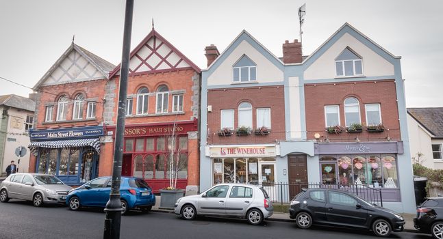 Howth, Ireland - February 15, 2019: Typical architecture of town center houses in a small fishing port near Dublin on a winter day