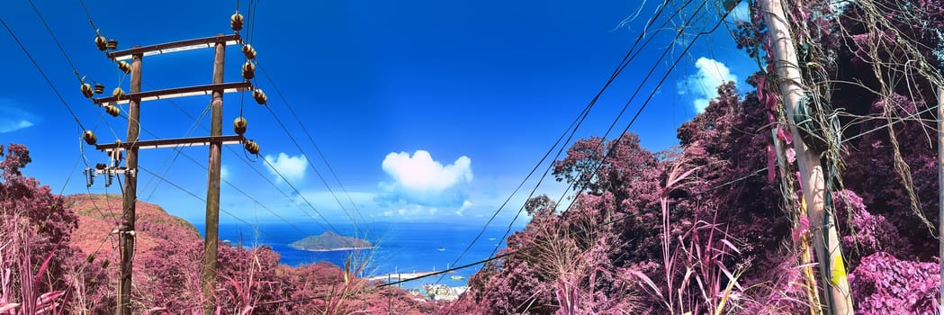 Beautiful purple and pink infrared panorama of a landscape on the Seychelles Islands.