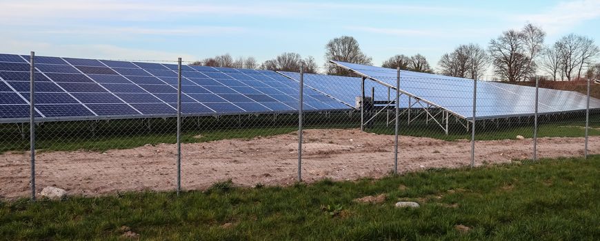 Generating clean energy with solar modules in a big park in northern Europe.