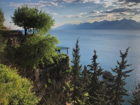 Landscape of Mediterranean sea trees mountains and blue sky