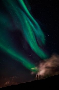 Green Aurora Borealis Northern lights shining with starlit sky, Nuuk, Greenland
