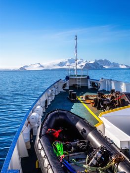 Ship's deck with zodiac boat, heading to Antarctic continent
