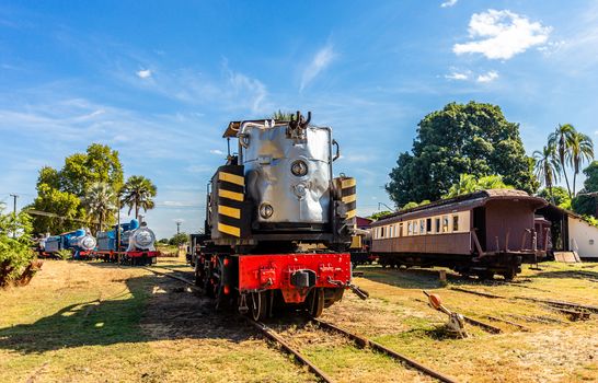 Old retro steel locomotive trains and wagons standing on the rails in Livingstone, Zambia