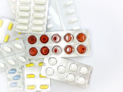 Different medicines: tablets, pills in blister pack, medications drugs, macro, space for text. Horizontal image