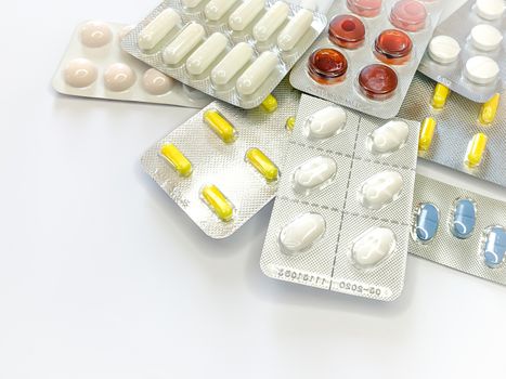Different medicines: tablets, pills in blister pack, medications drugs, macro, space for text. Horizontal image