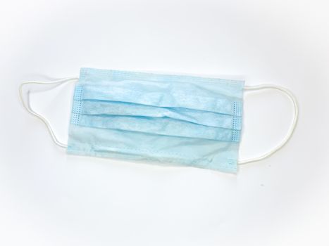 Antibacterial medical mask of blue color on a white background virus epidemic corona virus protection