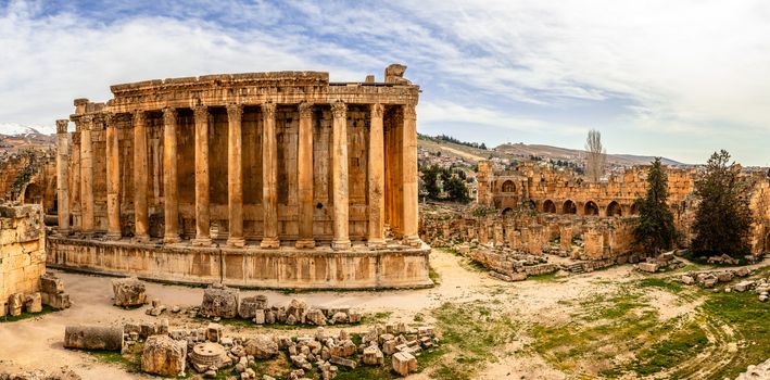 Ancient Roman temple of Bacchus panorama with surrounding ruins and city, Bekaa Valley, Baalbek, Lebanon