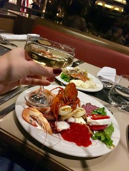 Oysters lobster crayfish craw fish caviar seafood and champagne on table in restaurant 