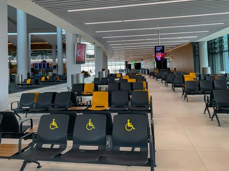 Empty Istanbul airport seats and halls no people during covid-19 corona virus pandemic epidemy in the world quarantine. Horizontal stock image