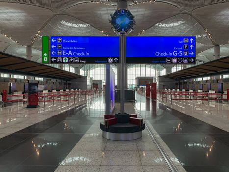 Empty Istanbul airport registration desks and hall no people during covid-19 coronavirus pandemic epidemy in the world quarantine. Horizontal stock photo