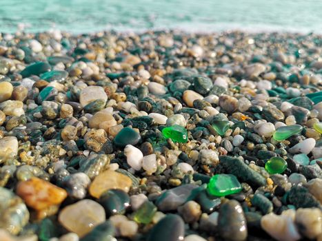 Green polished sea glass stones clam vacation holiday vacation sea shore background design idea