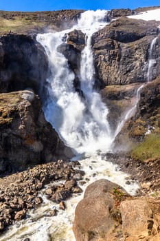 Rjukandi waterfall powerful streams falling from mountains, Egilsstadir, Eastern Iceland