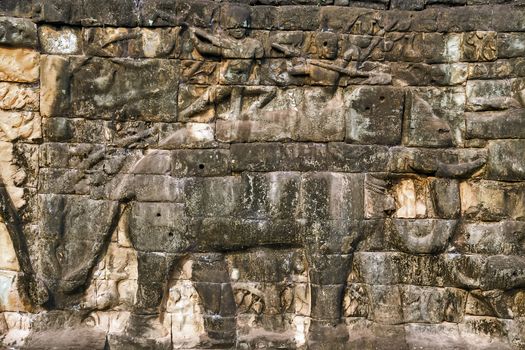 elephant Khmer relief carving of gods fighting demons. Inner wall of the temple of Angkor Wat, Siem Reap, Cambodia.