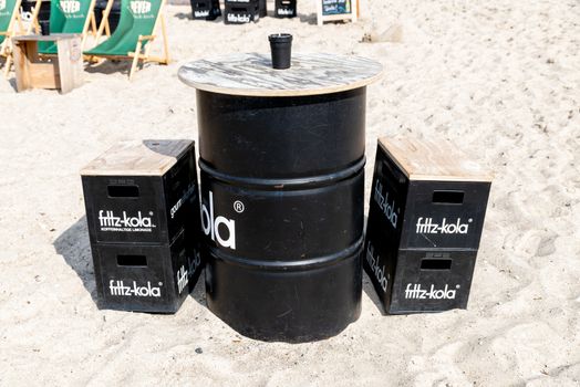 Fehmarn, Schleswig-Holstein/Germany - 05.09.2019: An original seat made of beverage crates and a keg from the company Fritz-Kola on a beach at the Baltic Sea
