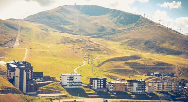 Saint Lary, France - August 20, 2018: Overview of the buildings of the Pla D Adet ski resort on a summer day