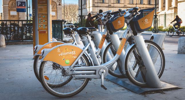 Montpellier, France - January 2, 2019: Velomagg bike sharing city bikes for rental in Montpellier. Bike sharing is a popular city transport