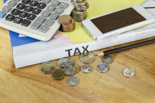 Tax documents and coin, calculator, on table in office concept Annual tax payment
