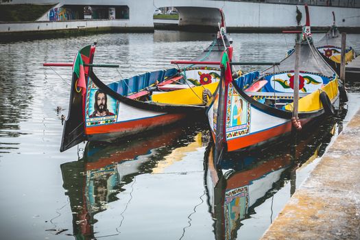 Aveiro, Portugal - May 7, 2018: view at the dock of the famous Moliceiros, traditional boats that used to harvest algae once and now transport tourists to the city canals