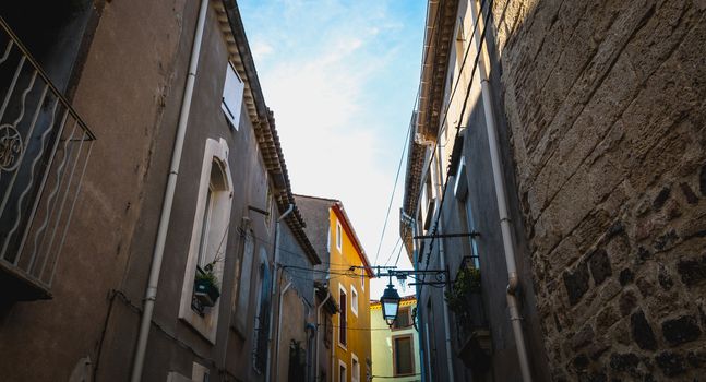 Marseillan, France - December 30, 2018: architectural detail of small typical townhouses in the historic town center of a small fishing port in the south of France on a winter day