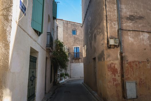 Marseillan, France - December 30, 2018: architectural detail of small typical townhouses in the historic town center of a small fishing port in the south of France on a winter day