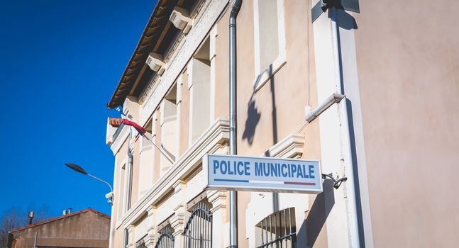 Marseillan, France - December 30, 2018: Architectural detail of the police station in the historic city center on a winter day