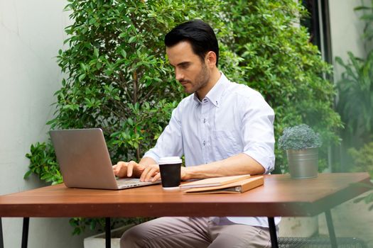 Young man working in the garden.