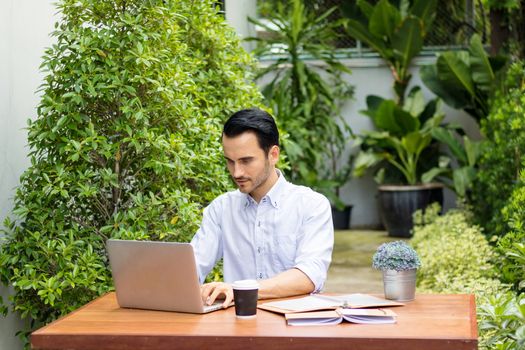 Young man working in the garden.