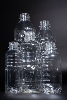 Plastic bottles, white garbage, clear, black background