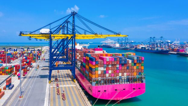Business logistics import export, Container cargo ship in seaport terminal with blue sky background, Container cargo vessel freight shipping company commercial worldwide, Freight transportation ship.