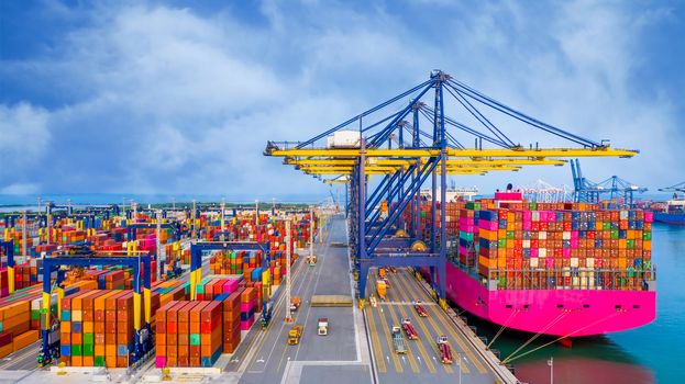 Business logistics import export, Container cargo ship in seaport terminal with blue sky background, Container cargo vessel freight shipping company commercial worldwide, Freight transportation ship.