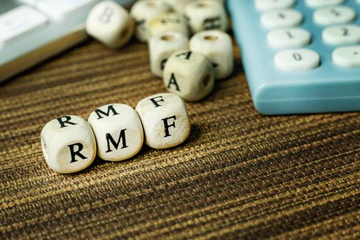 Text RMF on wooden cube image  for business content.